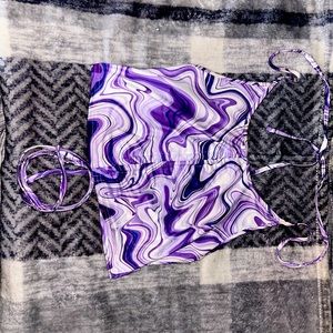 Purple colored cropped tank top with synch up middle tie around neck